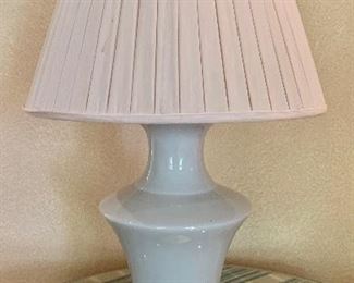 $900 Pair blanc de chine vases electrified with gilt caps and bases.  Fitted with beige silk box pleat lampshades.  Approx 30"H.