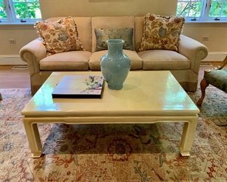 $1,500 as is. Three cushion rolled arm sofa upholstered stone/beige chenille and decadent fringe.  Minor damage to left side.  35"H x 88"W x 35"D.