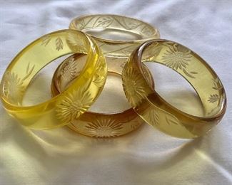 $50 Set of four yellow clear bracelets