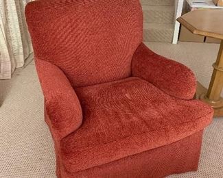 $1,295 Pair of custom rolled arm skirted swivel club chairs orange/red chenille fabric; 33.5"Hx38"Dx32"W