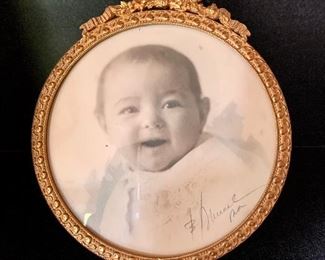 $60 Small round gilt frame