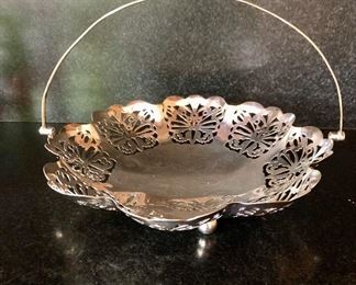 $22  Footed "butterfly" reticulated silver-plate tray with handle.  Approx 9.5" diameter