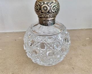 $120 cut glass bottle with sterling screw top 4.75"H