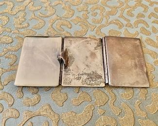 $30 Tiffany & Co sterling, folding  3 frame miniature mirror 5"L; needs help getting existing photos out!