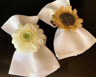 Flower napkin rings shown with napkins