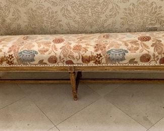 $1,200 French Louis XVI style gilt wood bench upholstered in beige and blue floral linen velvet with nailhead trim. 17.5"H, 14"D, 67.5"W