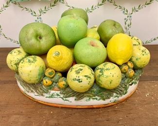 $120 Italian terra cotta oval fruit bowl filled with artificial fruit; @15" wide; 10.5" deep; 4.5: high