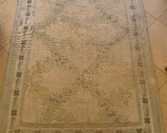 $195 Needlepoint area rug in shades of green, peach and cream. 