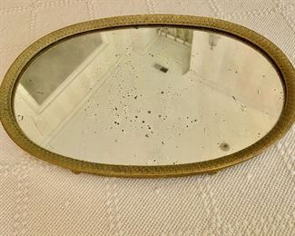 $295 Antique gilt rimmed oval vanity tray on feet