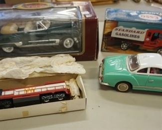 1038	TOY LOT 4 PC, COUPE DEVILLE, ESSO TRUCK, FRICTION CAR, AND HO GAUGE TRAIN ENGINE
