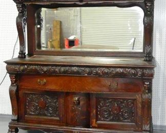 Heavily Carved Oak Figural Claw Foot Sideboard