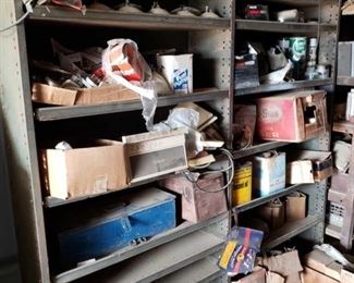 1003	

Shelving Unit with Headlights, Radiator Caps, Vintage Oil Cans, and More
Vintage Quaker State, Havoline, and Chevron oil cans
