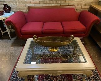 Antique sofa, beautiful coffee table with glass insert.  Great centerpiece.