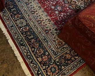 Area rug with deep red and blue tones.