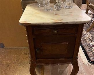 Marble top side table. Waterford pieces.