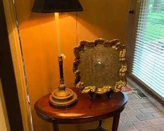 Beautiful oval side table, candlestick lamp and brass tray.
