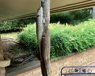 Hand carved wooden fish on string.