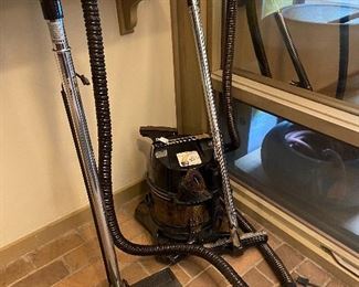 Rainbow SE vacuum with attachments.