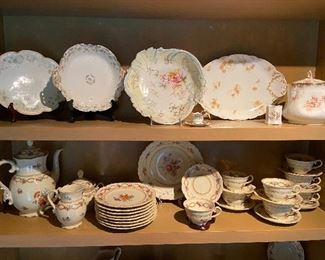Shelves full of antique painted china.