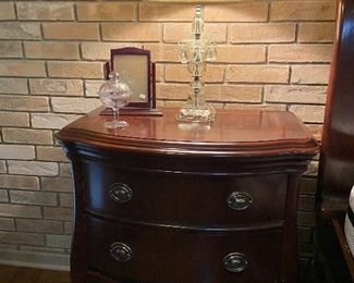 Two matching night stands to bed.