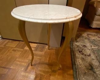 Gilded gold legged marble table.