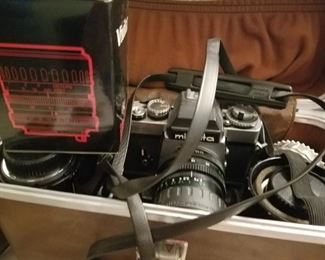 Vintage Minolta camera with bag and accessories
