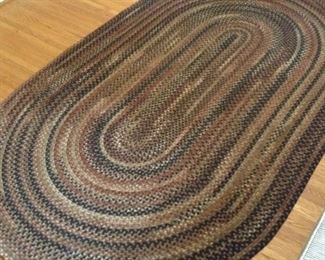 Wool Oval Braided Rug.  96L 60W, Great condition.  Colors are black, burgundy, tan, greens