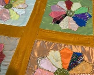Hand quilted comforter 58" x 86".  Pinwheel design, border is velour. $95. 
