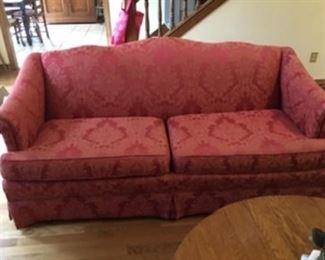 $150 Cranberry color damask sofa 