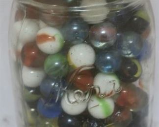Lot# 56 - Glass jar of marbles