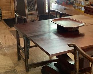 Pair of carved Chinese chairs and antique Empire game table