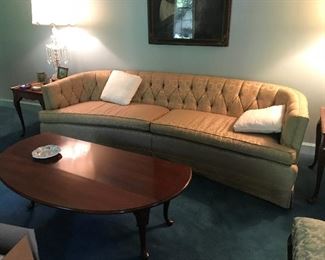 Gold brocade sofa and coffee table with Queen Anne legs