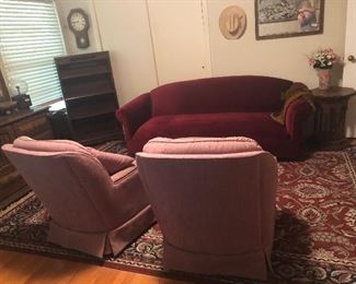 red velvet retro sofa and rugs and chairs 