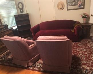 red velvet retro sofa and rugs and chairs