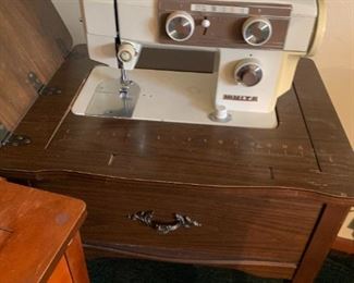 Also if sleek mid century design with a pop of color isn't the only reason you want to buy a sewing machine, here's another one without all of those things.  