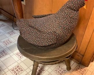 We were joking about this stool being like a butt warming stool, (there's a space inside that looks like it's for coal) and when I looked it up sure enough - it's a warming stool!  but for you feet not butt.  Also a chicken