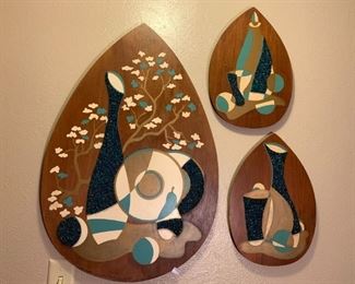 Ah, finally a better picture!  So I did some research and these are Mid Century gravel art made by the Illinois Moulding company.  
