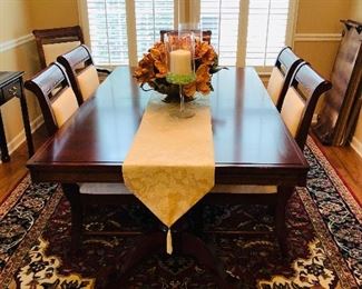 $595, Ashley dining table with one leaf, pads and 6 chairs