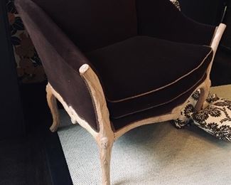 Large velvet chair with wood limb detail