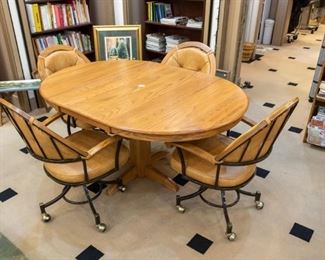 Oak table, rolling chairs.  Great condition.