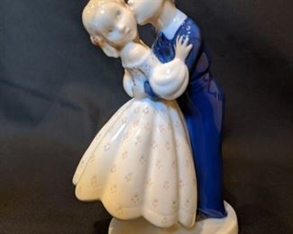 Another Danish Porcelain piece, also from Copenhagen, by the B & G (Bing & Grondahl) company, "First Kiss", #2162.                                                                                                       She looks like she's really diggin' it, huh?