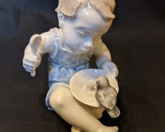 Vintage Rosenthal porcelain figurine, "Girl with Bird". Looks like she's ready to pop that thing if it takes ONE more bite of her birchermüesli. 