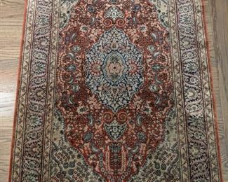Vintage Persian Isfahan rug, hand woven, signed, 100% silk, measures 3' 4" x 5' 6".