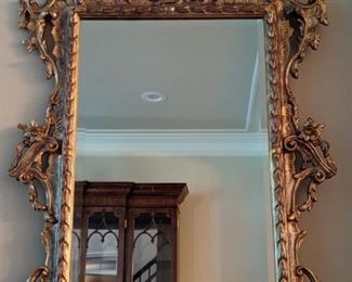 Vintage, gilded carved wood wall mirror, with beveled glass.