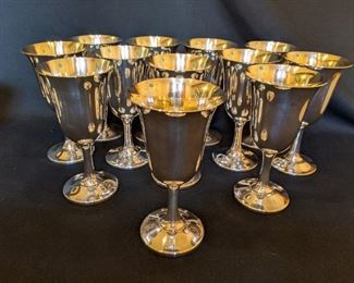 Set/12 sterling silver 6 3/4” tall # 14 goblets, by Wallace; the entire set weighs 76.5 oz.