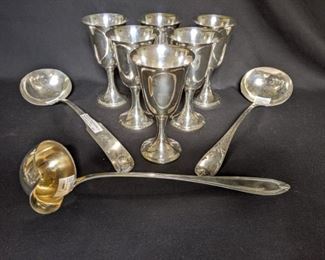 Set/6 sterling silver 6 3/4” tall goblets, from Bromberg & Co. Birmingham, AL; the entire set weighs 27 oz., or 774 gm.                                                                                                          Three large, vintage silverplated ladles:                                   1)  American Silverplate, from George R. Downing Silver Co. 1815 - 1825                                                                                       2)  13" silverplated ladle, by A. H . DeWitt                               3) G. Schroeter German 800 silver ladle