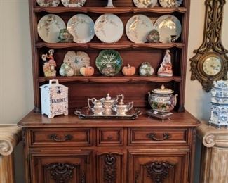 18th century French walnut Buffet de Coeur, or Vaisselle, with all the right stuff, GREAT hand-carving and perfect patina.                                                                                                      Nice selection of European porcelains and good American silverplate. The base measures 54"L x 40"W x 20"D , the top measures 8"D x 51"T.