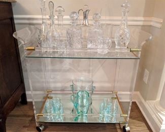 Very cool Lucite/brass mirrored tea cart, with cut crystal decanters.
