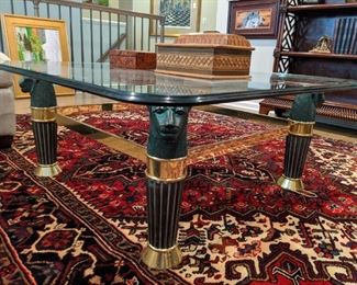 Close-up of the vintage lion head coffee table, with ogee  edge. Vintage Persian Heriz rug, hand-woven, 100% wool face, measures 6'8" x 9' 6".