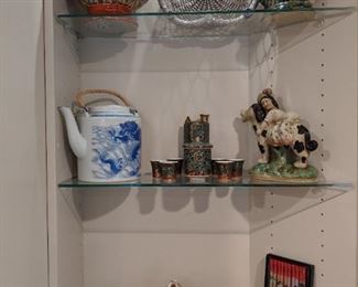 Asian porcelain collection, fun whistling teapots.